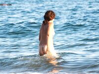 Splashing and Laughing Through Shallow Nude Beach Waves