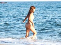 Splashing and Laughing Through Shallow Nude Beach Waves