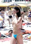 Topless Beach Sunbather in Floral Bikini Bottoms on Sand