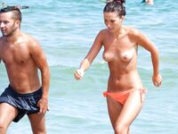 Orange Bikini Bottoms and Wet Skin Stepping Onto a Topless Beach