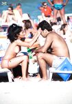 Orange Bikini Bottoms and Wet Skin Stepping Onto a Topless Beach