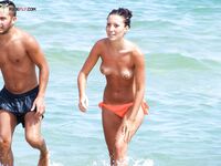 Orange Bikini Bottoms and Wet Skin Stepping Onto a Topless Beach