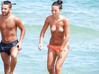 Orange Bikini Bottoms and Wet Skin Stepping Onto a Topless Beach
