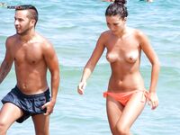 Orange Bikini Bottoms and Wet Skin Stepping Onto a Topless Beach