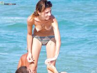Sunscreen at the Shoreline on a Midday Topless Beach