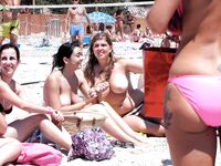 Standing at the Shore Beside Her Seated Companion