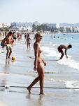 Walking the Shoreline Topless in Pink Bikini Bottoms