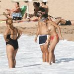 Walking the Shoreline Topless in Pink Bikini Bottoms