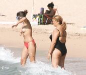 Walking the Shoreline Topless in Pink Bikini Bottoms