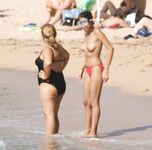 Walking the Shoreline Topless in Pink Bikini Bottoms