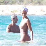 Finding peace in the simplicity of a beach day without a bikini top. 2