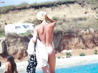 Just getting an all over tan. People on the strand enjoyed the view. Also the neighbors on the balcony. 2