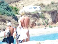Just getting an all over tan. People on the strand enjoyed the view. Also the neighbors on the balcony. 2
