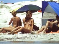 A Flower in Her Hair on a Barefoot Nude Beach Pause
