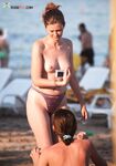 The natural glow of a woman who spends her summer days topless by the sea. 3