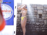 The liberation of a day at the beach with no tops and no social worries.