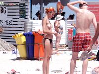 A model posing naturally among the grass dunes in a nude fashion. 6