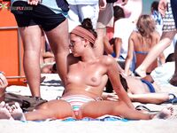 A model posing naturally among the grass dunes in a nude fashion. 6