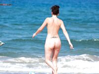 A relaxing session on a wooden pier, enjoying the heat in a European topless fashion.
