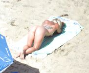 Capturing the aesthetic of a topless afternoon at a private coastal resort. 6