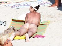 . Embracing a life without tan lines at a stunning, clothing-optional beach. 4