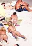 . Embracing a life without tan lines at a stunning, clothing-optional beach. 4