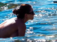 topless coastal relaxation in sunshine
