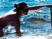 topless coastal relaxation in sunshine