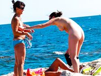 topless coastal relaxation in sunshine