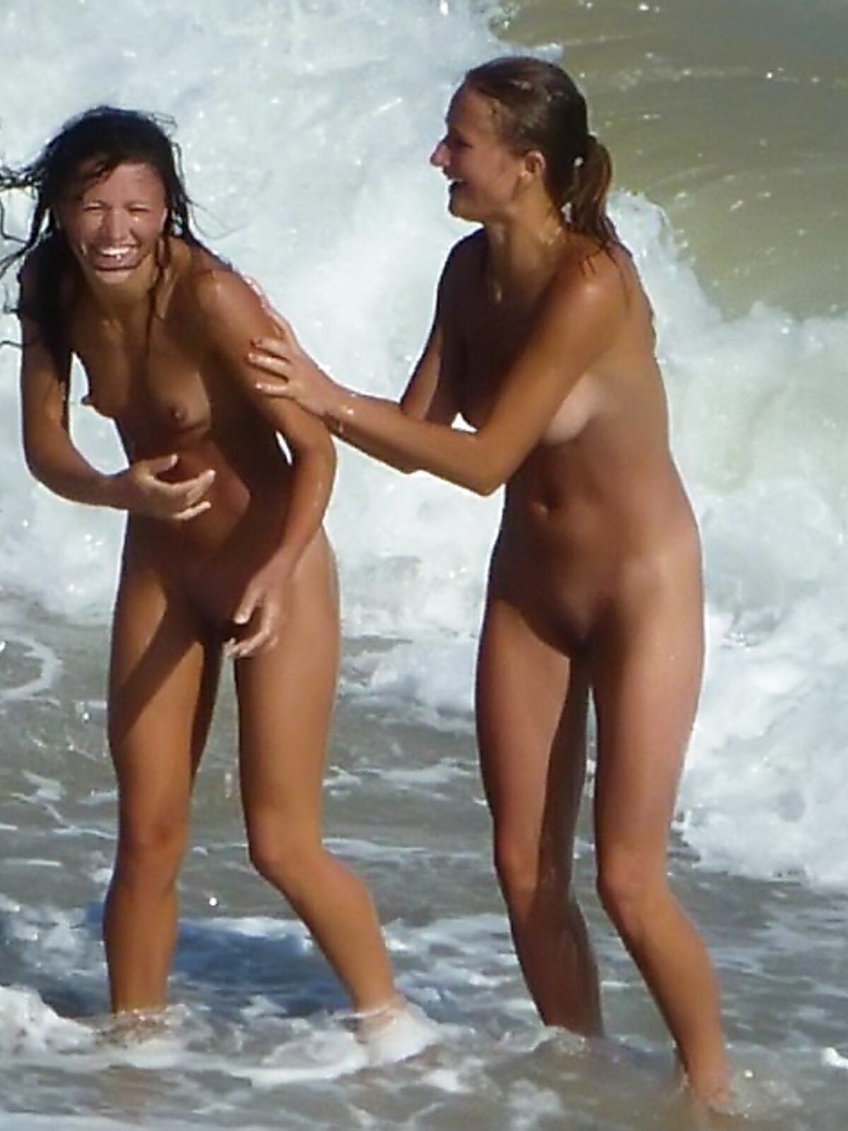 Two Women Laugh in the Rolling Waves at a Nude Beach album preview