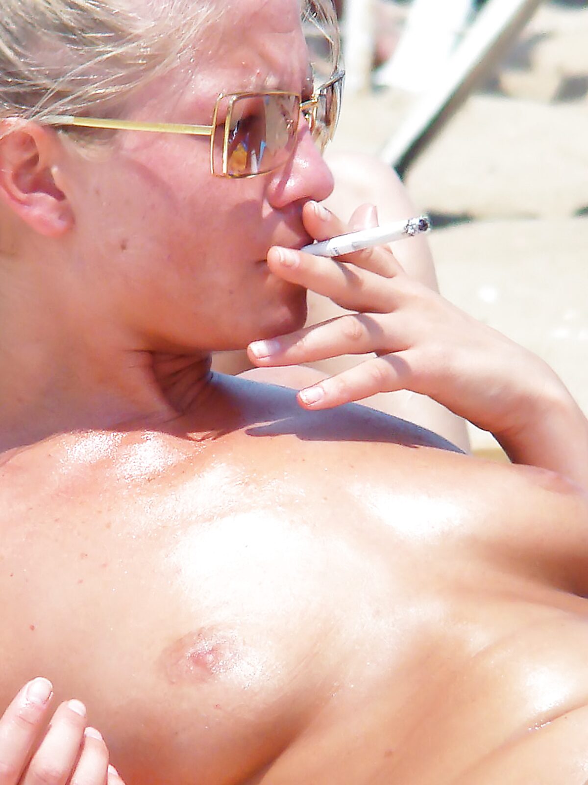 MILF at a nudist resort enjoys the sun for a bit album preview