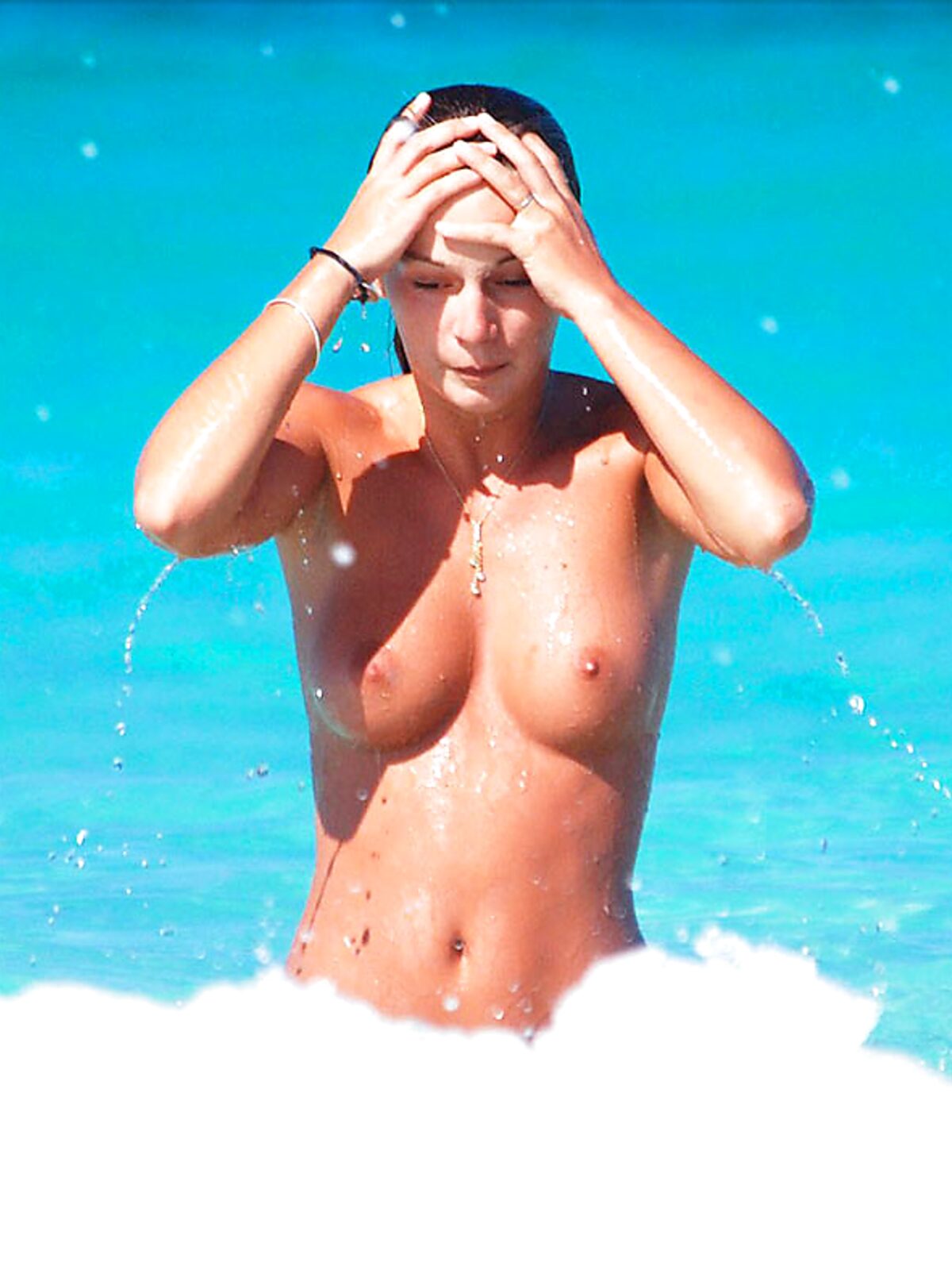 Finding the perfect spot for sunbathing without a top on the golden sand. 5 album preview