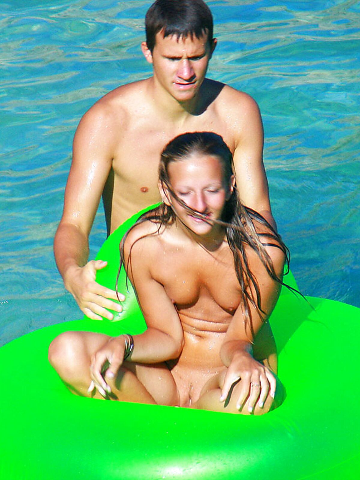 Drifting Together on a Green Inflatable Ring in Turquoise Water album preview