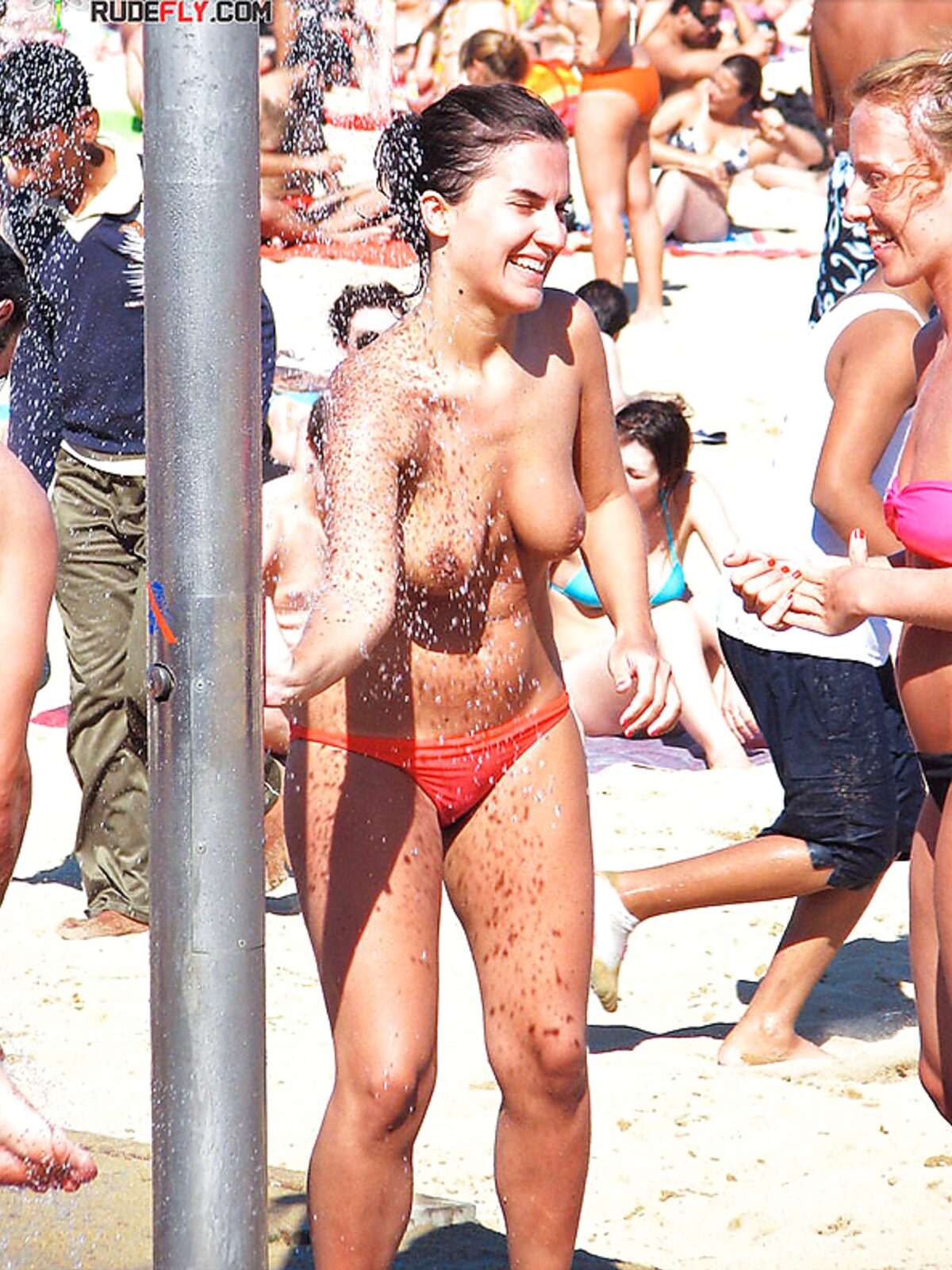 Here I am quietly posing for pictures while being watched by a nude guy on the strand. album preview
