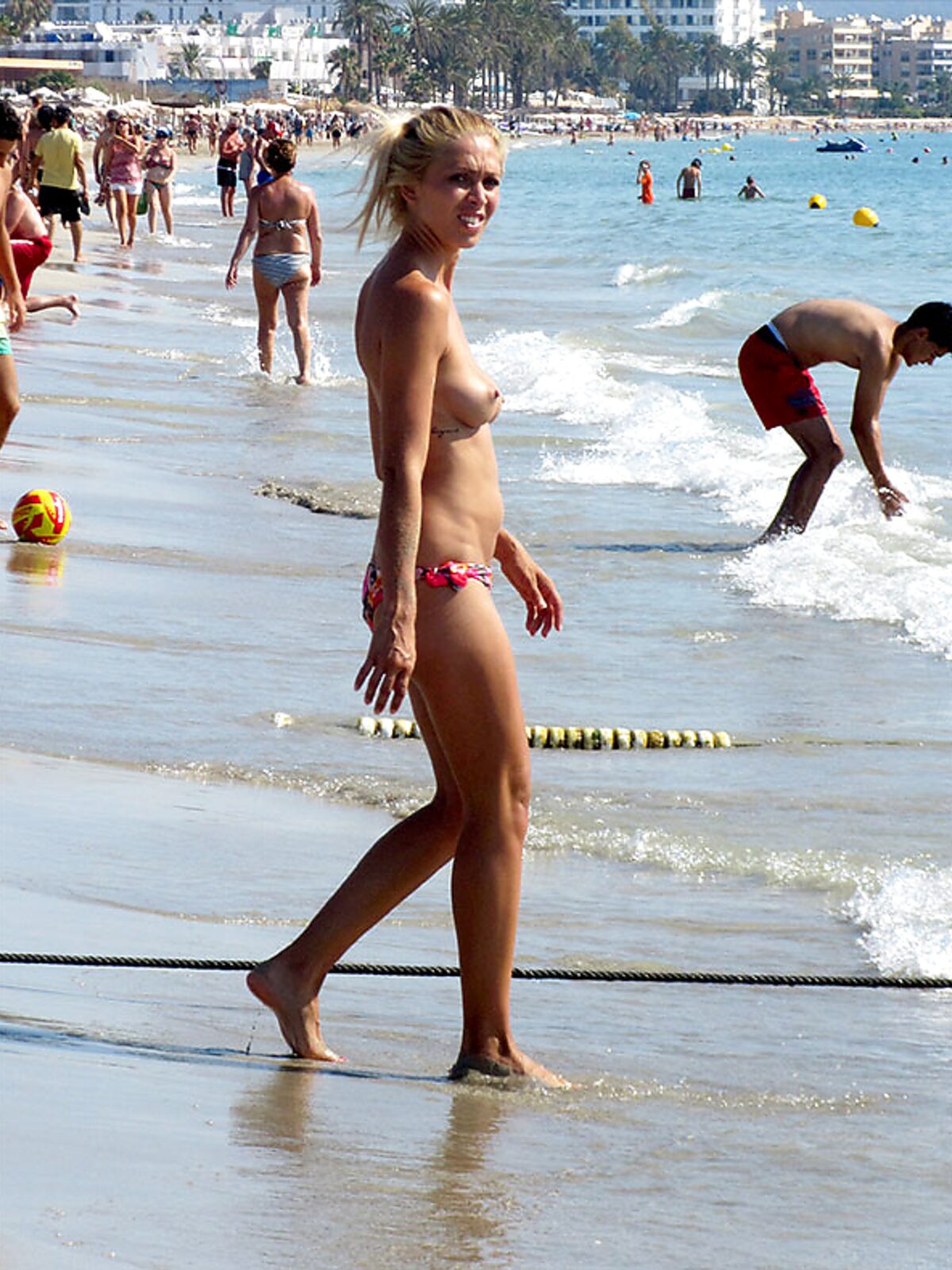 Walking the Shoreline Topless in Pink Bikini Bottoms album preview