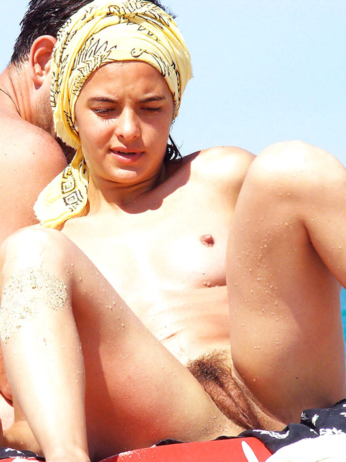 Just getting an all over tan. People on the strand enjoyed the view. Also the neighbors on the balcony. 2 album preview