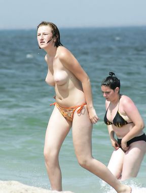 The girl is always topless, even on a regular beach, and her boyfriend doesn't mind that at all 3