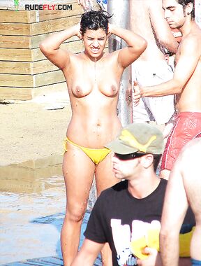 Artful photography of a woman enjoying the freedom of a clothes-free holiday.