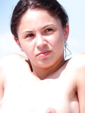 Clear-Sky Topless Sunbathing on a Warm Summer Beach Day
