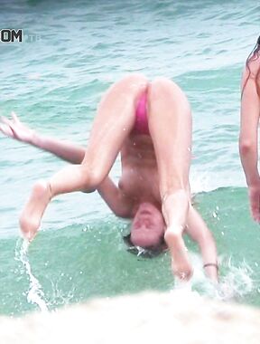 A Headfirst Dive Into the Waves in Pink Bikini Bottoms