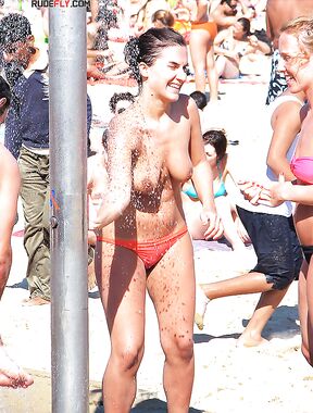 Here I am quietly posing for pictures while being watched by a nude guy on the strand.