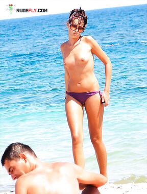 . Capturing the radiant glow of a sun-lover at a clothing-free beach. 2