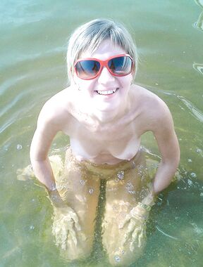 Wading Into Calm Shallow Lake Water on a Sunny Day